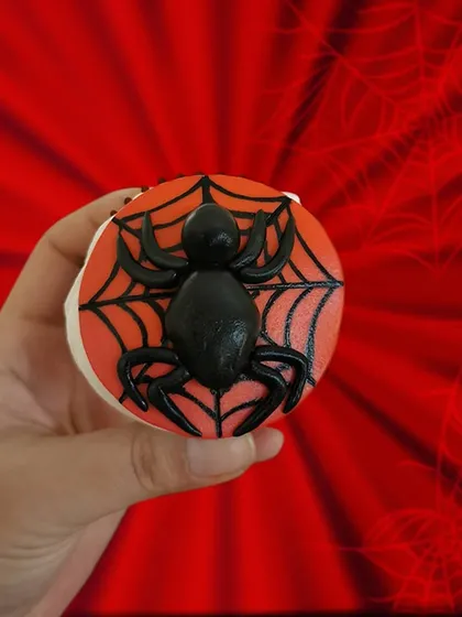 Here's a close-up of my Spiderman cupcake. I used fondant to create a clean, sharp design with the iconic web and a 3D spider. It’s a design that always gets the kids excited.
