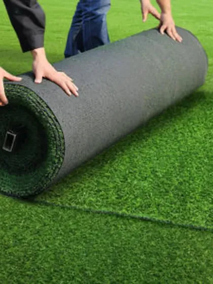 My team unrolling artificial turf during a large-scale installation. I can handle projects of any size, ensuring a seamless and professional finish.