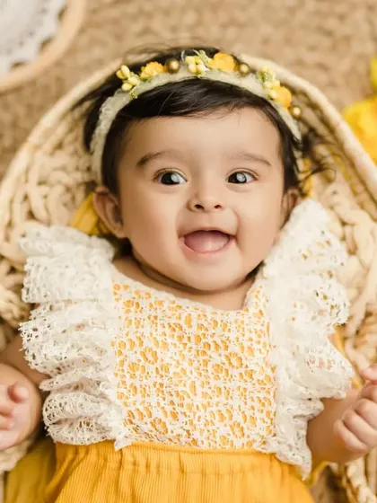 The happiest little sunflower. This close-up shot captures the pure joy of a 6-month-old baby.