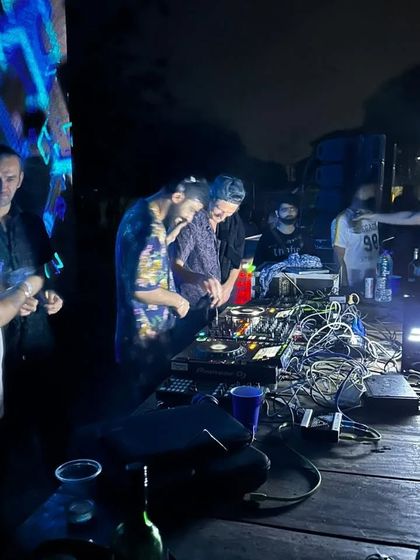 Another shot from the Vortex party, with the complex wiring of the DJ setup showing the technical side of the craft.