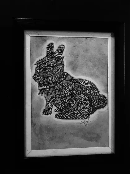 A rabbit filled with intricate patterns, sitting peacefully. A lovely piece of zentangle animal art.