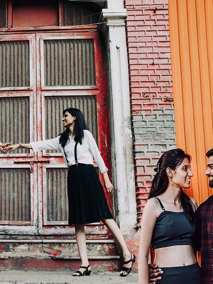 A collage of candid moments from a pre-wedding shoot in the colorful lanes of Mumbai.