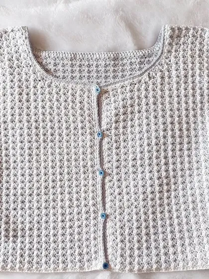 A flat-lay of the CoCo Jacket, showing the full construction and design.