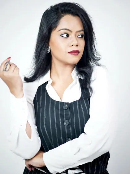 A crisp white shirt and a pinstripe vest create a timeless professional look. My personal styling services focus on curating such essential pieces to build a versatile and impactful corporate wardrobe.