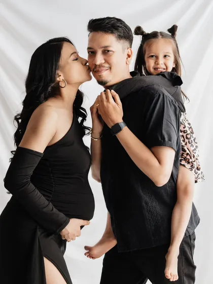 Maternity shoots are for the whole family! It was so much fun capturing the excitement of this soon-to-be big sister. This playful piggyback ride created such a genuine, happy family portrait, celebrating the new baby on the way.