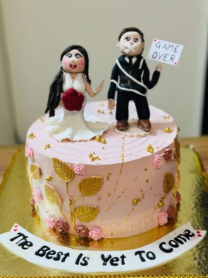 A humorous "Game Over" cake for a bride and groom to-be.