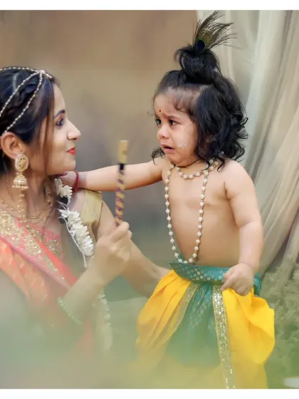 Even the tearful moments are worth capturing. This candid shot from a Krishna-themed shoot shows a real, unfiltered moment between mother and child.