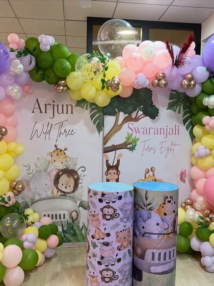 Another view of the joint birthday setup, showing the custom-printed plinths and character cutouts that add detail and fun.