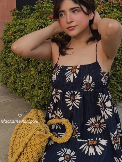 Modeling our mustard yellow macramé beach bag. It's a lightweight yet sturdy bag with a beautiful texture, perfect for a sunny day out.