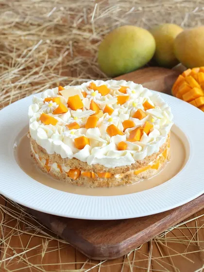 Our Mango Tres Leches cake is a tropical twist on a classic, soaking a light sponge in three kinds of milk and topping it with fresh mango.