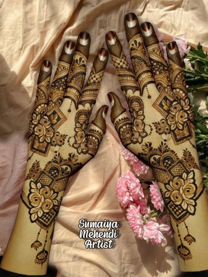 A beautiful party henna design with a mix of roses and geometric shapes, perfect for any celebration.