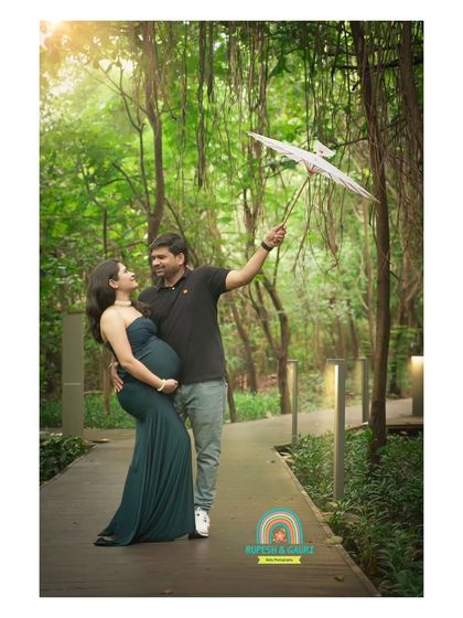 A playful and romantic shot using a paper umbrella as a prop. We love incorporating creative elements that add a touch of whimsy to our outdoor maternity sessions.