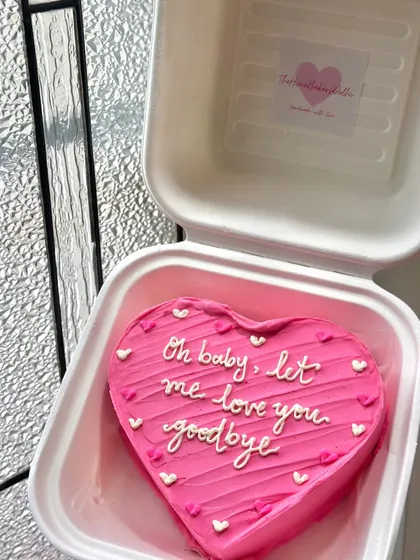 A bright pink heart-shaped bento cake with a sweet and slightly sad message. Our cakes are here for all of life's moments, big and small.