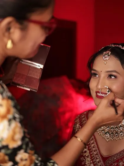 A beautiful interaction between me and the bride, ensuring she is comfortable and happy with her look.