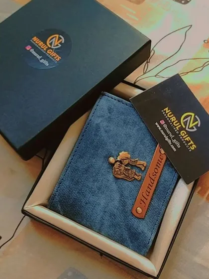 This personalized denim wallet with a 'Handsome' tag and a gym-themed charm is shown with its branded packaging, making it a complete gift.