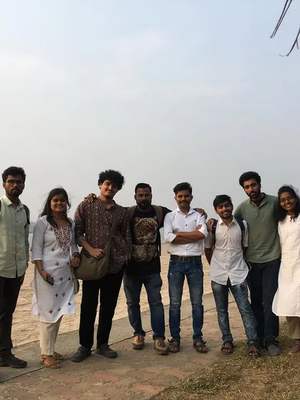 A group photo with fellow artists at the Indian Navy Day painting workshop.