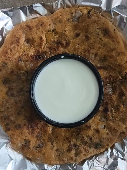 My special Mix Paratha served with fresh curd. The paratha is stuffed with a mix of vegetables and is a wholesome meal in itself.