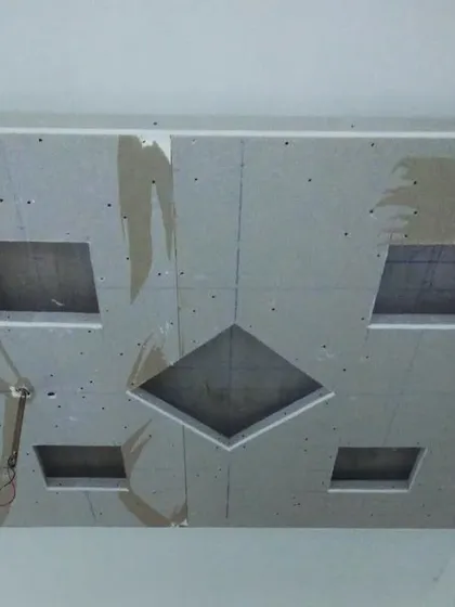 An in-progress ceiling with square and diamond-shaped cutouts. These will later become features for recessed lighting or decorative panels.
