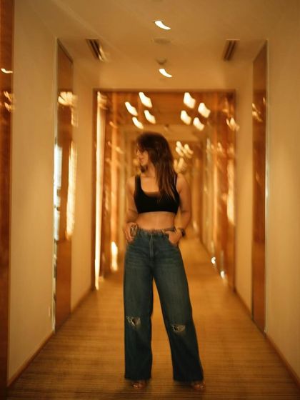 Another shot of my casual look. Wide-leg jeans are my go-to for comfort and style.