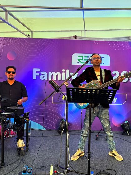 The duo on guitar and drums, creating a powerful rhythm section for the Rebit Family Day gig.