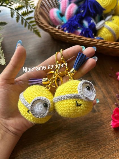 Our minion crochet keychains are perfect for fans of the little yellow characters. This close-up shows two of them, complete with their signature goggles and a tiny smile.