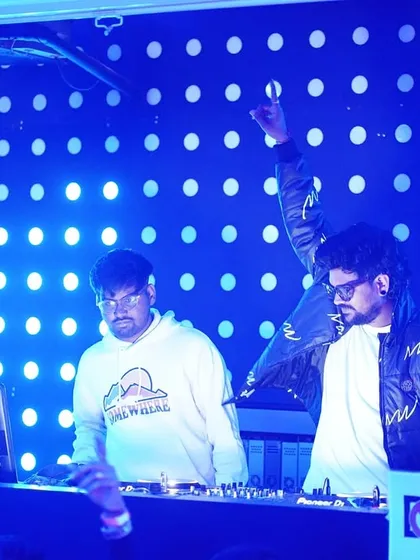 On the decks with a fellow artist, sharing the energy and creating a memorable B2B set.