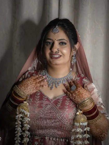 A portrait focusing on the bride's happiness and her stunning diamond necklace set.