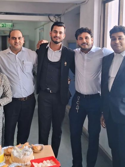 Celebrating a colleague's birthday at the office. We are more than just a team; we are a work family.