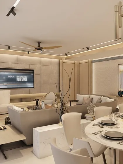 This contemporary living and dining area in a Pune apartment at Hyde Park reflects a deep appreciation for art, design, and elegant simplicity. Elegant wall paneling anchors the space, pulling every element into a cohesive composition of neutral tones and curated artwork.