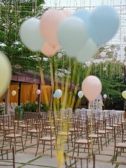 I used large, floating balloons in pastel shades to decorate the seating area, adding to the light and airy feel of the outdoor carnival.