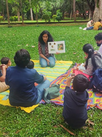 Reading 'The Gruffalo' to an eager audience. Using different voices and expressive gestures, I bring the classic characters of the deep, dark wood to life.