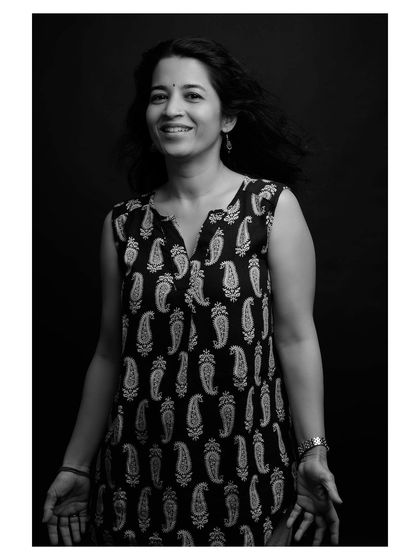 Another frame from the same session, capturing a bright and engaging expression in timeless black and white.