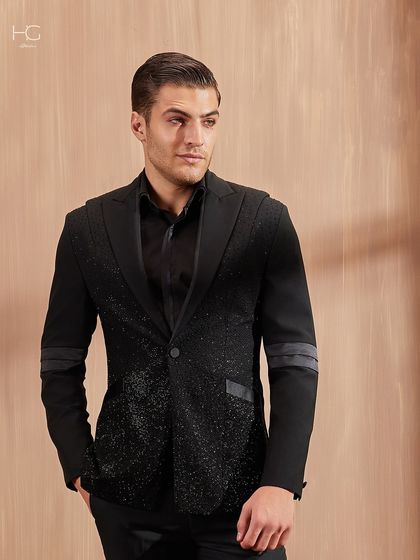I designed this piece to raise the bar for cocktail party attire. The jacket features a glittering textured fabric on the body, contrasted with solid black sleeves and lapels for a dramatic effect.