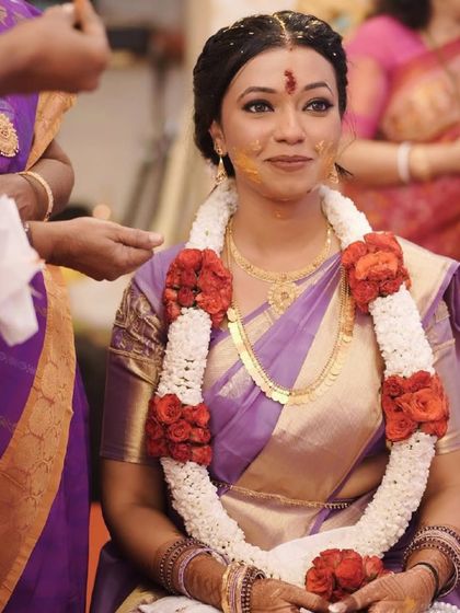 Bringing out the timeless elegance of a South Indian bride. The makeup is classic and radiant, with a focus on her beautiful features.