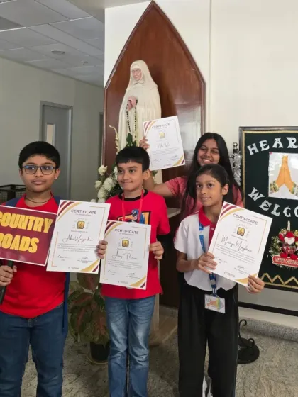 The "Country Roads" band proudly shows off their certificates. We encourage our students to explore various genres, from classic American folk to Bollywood hits.