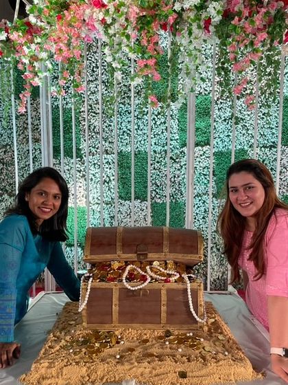 Posing proudly with my client next to the giant edible treasure chest cake we created for her event. This was a massive and rewarding project!
