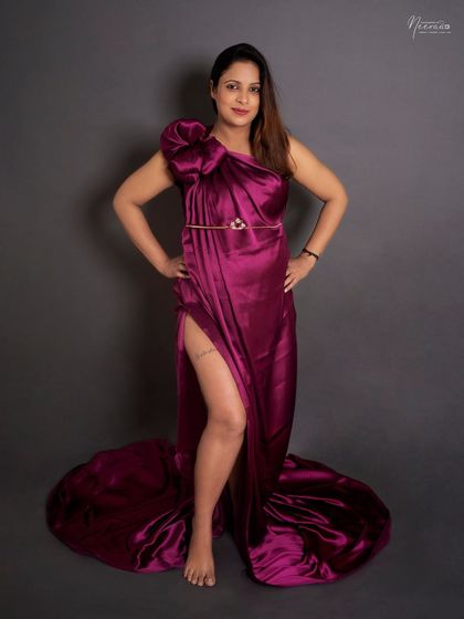 Confidence and style. This pose with a hand on the hip and a high slit in the gown is for the mom who wants to celebrate her body with a bold and fashionable statement.