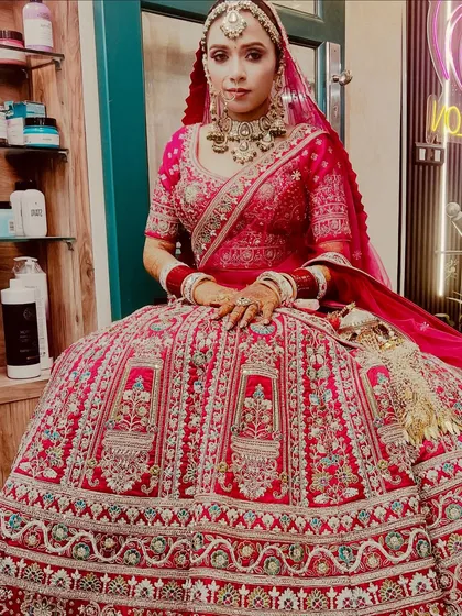 A beautiful bride ready for her Anand Karaj ceremony in a stunning pink lehenga. The makeup is kept radiant and fresh to match the daytime event, with a focus on glowing skin and elegant details.