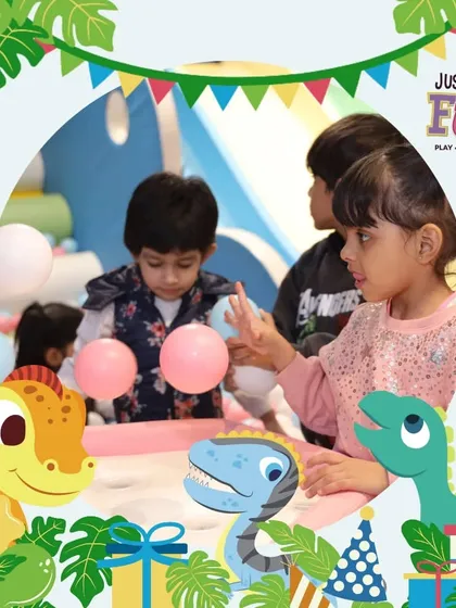 Our dinosaur-themed parties are filled with prehistoric fun. Here, kids are engaged in a fun activity at a table decorated with cute dino graphics.