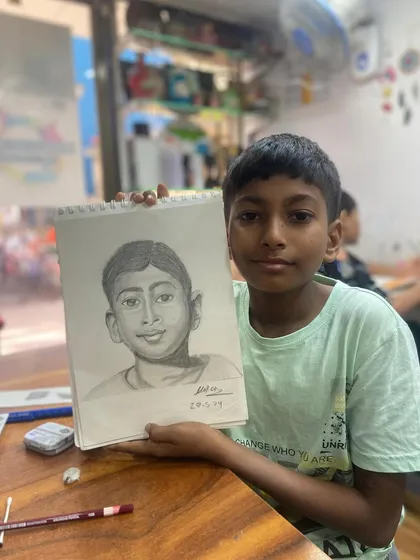 It's an incredible moment of pride for us and our student. This is the result of our portrait sketching course, where this talented 13 year old artist brought his own self portrait to life with pencil and paper.