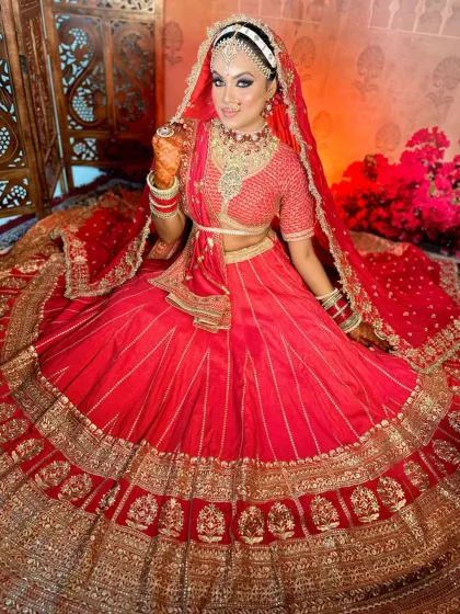 The complete royal bride. This shot showcases the harmony between the makeup, the heavy jewelry, and the intricate red lehenga, a key aspect of my bridal styling lessons.