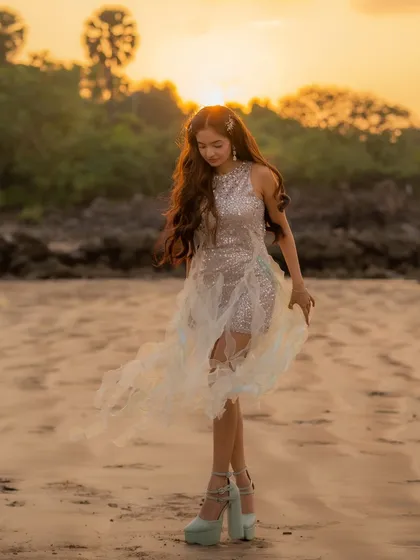 Styling for music videos is about creating a fantasy. For Anushka Sen's video, we designed this ethereal, customized sequined dress with a flowing tulle skirt, perfect for a dreamy sunset shoot on the beach.