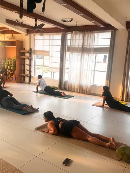 Students rest in a gentle backbend, allowing their bodies to absorb the benefits of the practice.