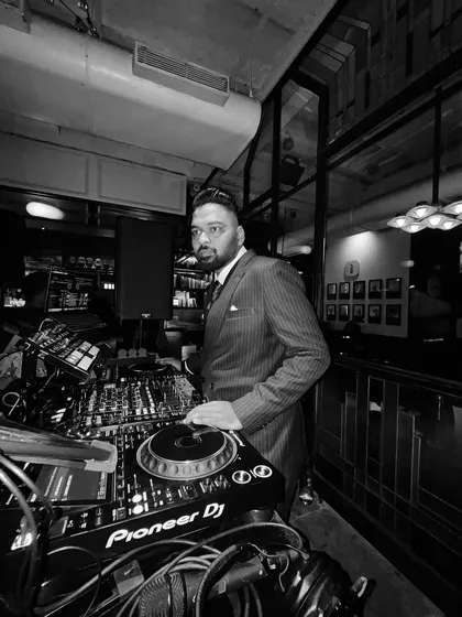 A full view of my setup at a corporate gig. Even in a formal setting, I use professional-grade Pioneer DJ equipment to ensure the best sound.