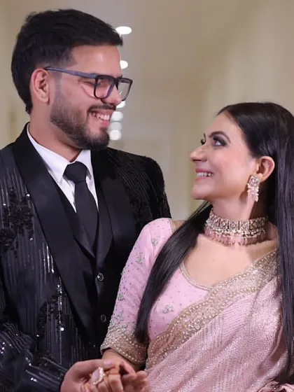 A happy, smiling couple. Their joy is infectious.
