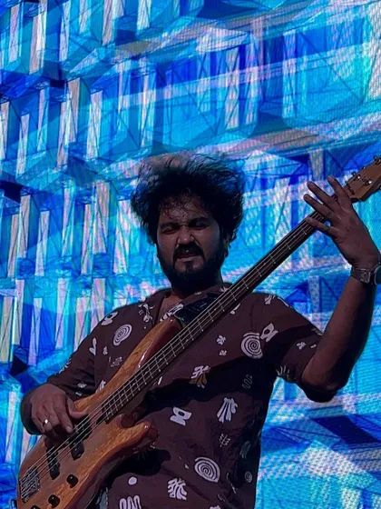 Our bassist in his element, laying down the groove for the Saraswat Bank team. The stage lighting and visuals were on point.
