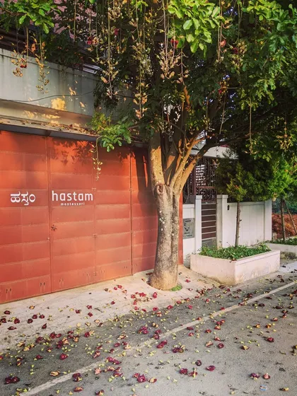 Our entrance, with its name in both English and Kannada, is often greeted by a natural carpet of flowers from the tree above. I believe a child's learning environment should feel as welcoming and beautiful as nature itself.