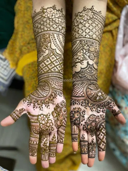 A throwback to a Karwa Chauth design. This one is a full bridal-style mehendi, with intricate bands running up the arm and detailed work covering the entire palm.