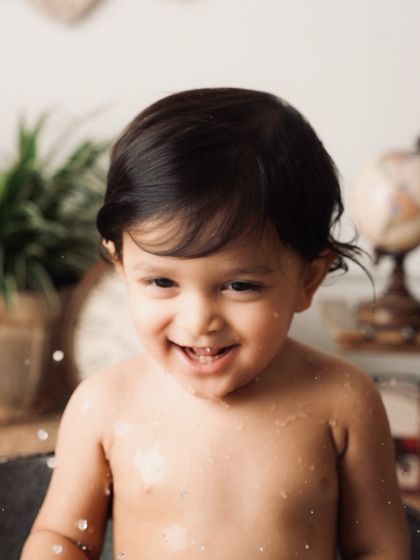 A huge, giggling smile from the baby in the tub. This is what pure, unadulterated happiness looks like.