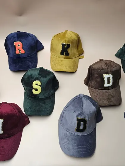 Make a style statement with our trendy suede caps, personalized with a sequin initial. They are available in a variety of colors.